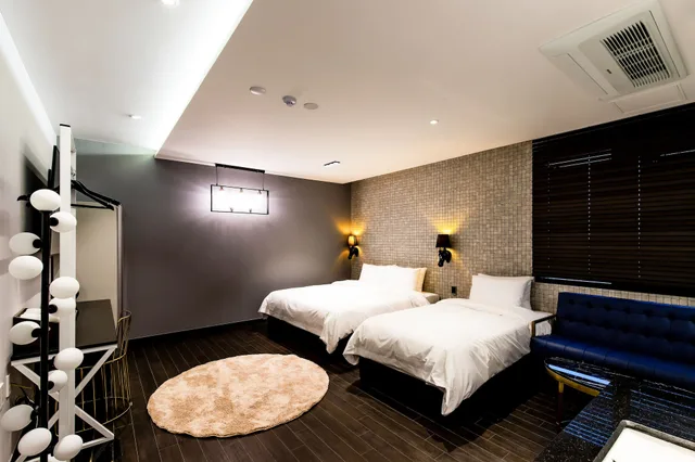 غرفة بزنس بسرير مزدوج وسرير فردي، Air Sky Hotel Busan 4/7