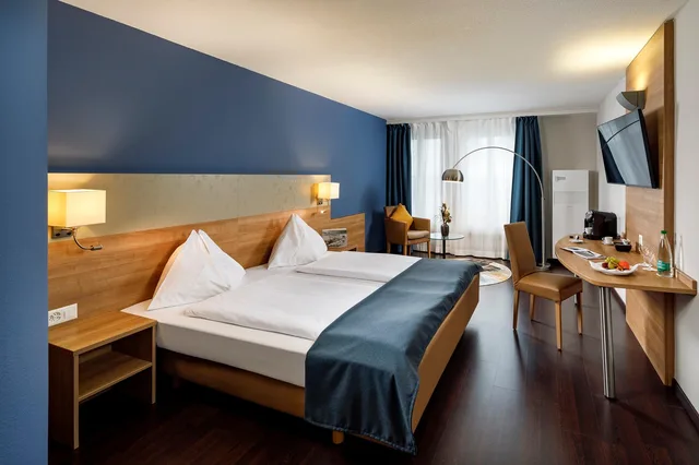 غرفة عائلية بسرير كينج وسريرين فرديين، Olten Swiss Quality Hotel 1/2