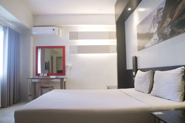 غرفة قياسية بسرير كوين، Executive Hotel Manila 1/4