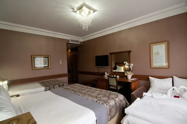 غرفة عائلية بسرير كينج وسرير فردي بإطلالة على المدينة مع أريكة، FERMAN HOTEL 4/11