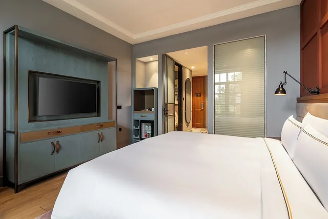 غرفة متصلة عائلية بسرير كينج بشرفة مع أريكة، Melia Shanghai Parkside 2/4