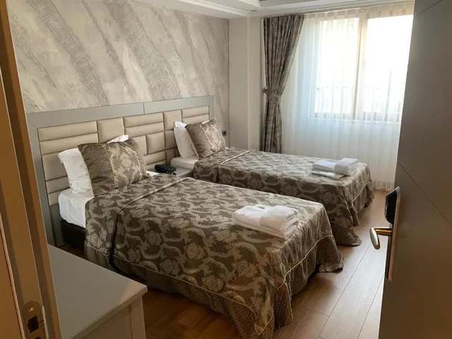 غرفة قياسية بسرير مزدوج أو سريرين منفصلين، Regency World Suite 2/7