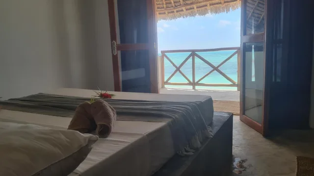 غرفة ديلوكس بسرير مزدوج بإطلالة على البحر بشرفة، Garden Beach Bungalows 2/4