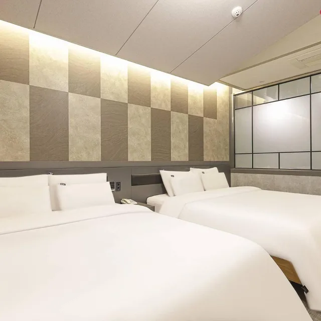 غرفة كبيرة بسريرين منفصلين، Jinju Kai Hotel 2/3