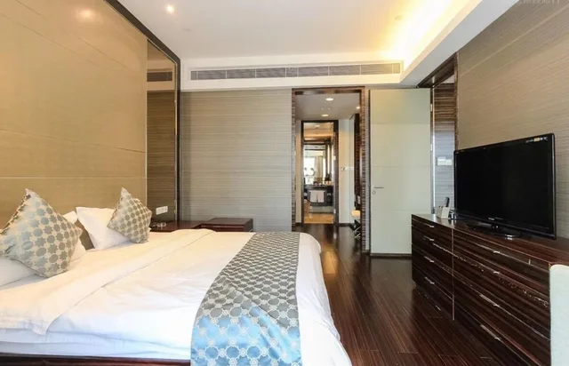 غرفة ديلوكس ثلاثية بسريرين منفصلين وسرير كينج، Side Apartment 1/10
