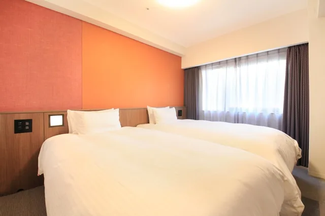 غرفة بسريرين منفصلين للمدخنين، RICHMOND HOTEL KAGOSHIMA KINSEICHO 1/5