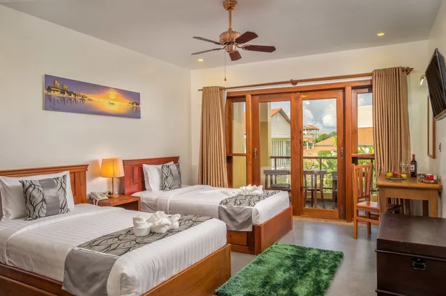 غرفة ديلوكس بسريرين منفصلين بإطلالة على المسبح بشرفة، Savada Angkor Boutique Hotel 3/5