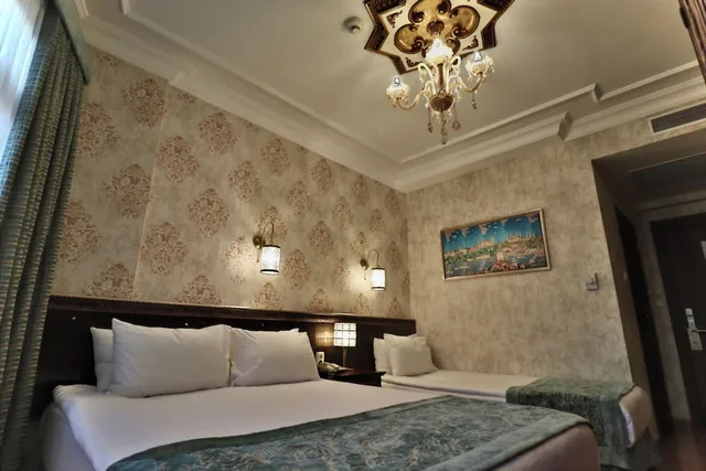 غرفة سوبيريور ثلاثية بسرير كوين وسرير فردي بإطلالة على البحر، Blue House Hotel 2/5