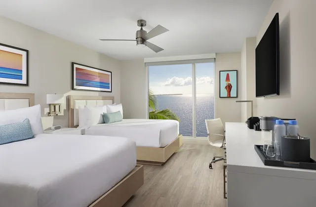 Harbor View Queen Queen, 400 Sq Ft - Luxury Linens & Bath Amenities, 65 Inch TV-Coffee Maker-Wifi-in Room Safe، Sunseeker Resort Florida Gulf Coast , Curio Collection 1/2