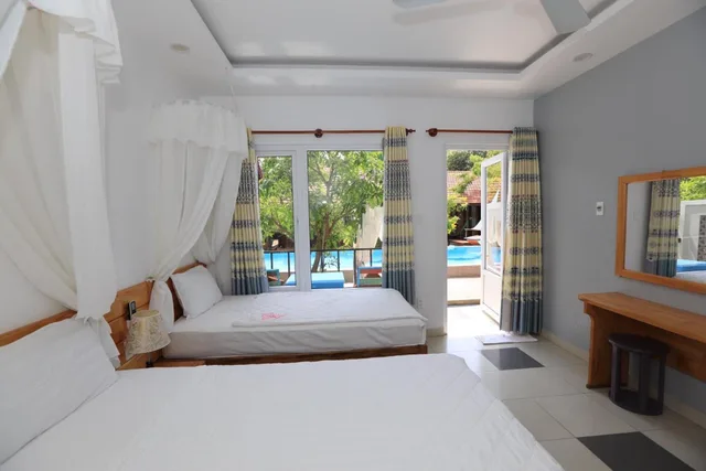 غرفة ثلاثية بسرير مزدوج وسرير فردي، May Bungalow 1/1
