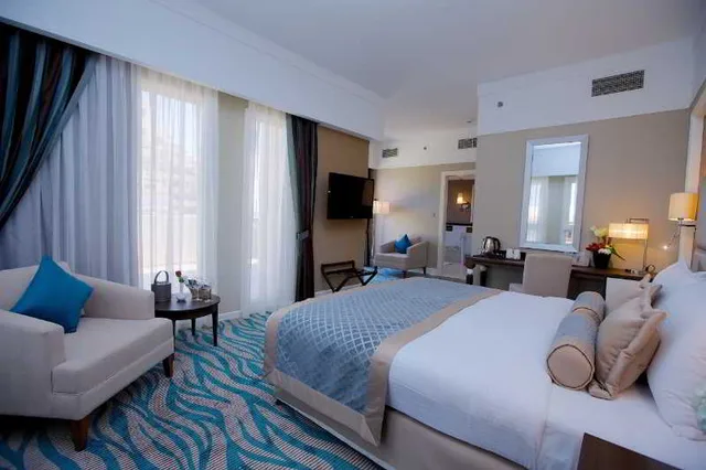 غرفة ديلوكس بسرير مزدوج أو سريرين منفصلين بإطلالة على الحديقة، Rixos Bab Al Bahr 1/1