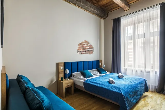 غرفة ديلوكس رباعية بسريرين منفصلين مع أريكة، Aparthotel Pergamin 2/7