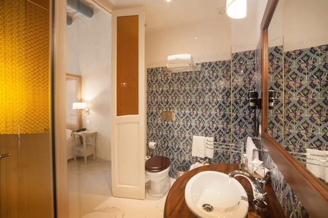 جناح جونيور بسرير كينج مع أريكة، ALGILÀ ORTIGIA CHARME HOTEL 1/3