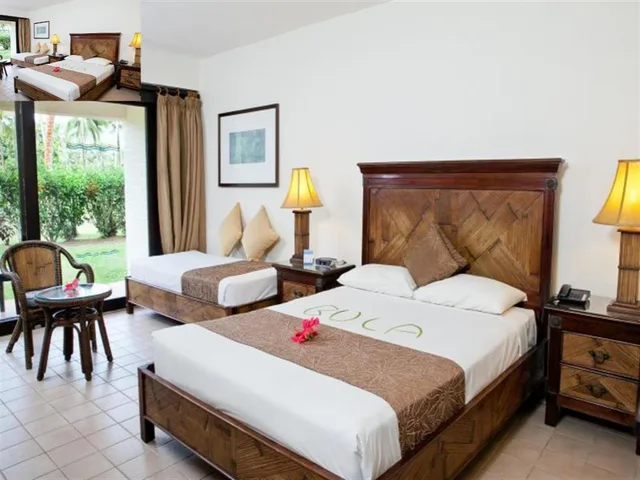 غرفة بسرير كوين وسريرين مزدوجين وسرير كوين بإطلالة على الحديقة، The Naviti Resort 2/5