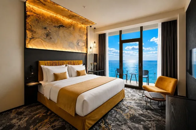 جناح بريميوم بسرير كينج بإطلالة على البحر مع أريكة بمطبخ صغير، Miramare Magnetic Beach Hotel 2/9