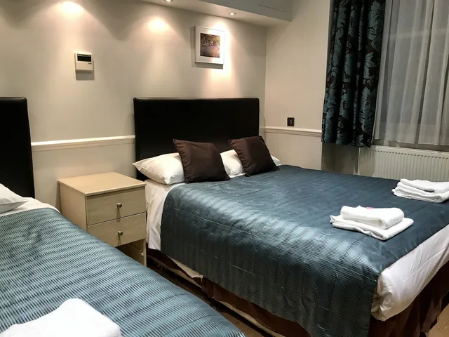 Semi Basement, Triple, 1 Double and 1 Single Bed، Rhodes Hotel 1/2