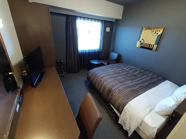غرفة بسرير كوين في المبنى الرئيسي للمدخنين، Hotel Route-Inn Iwakiizumi Ekimae 1/8