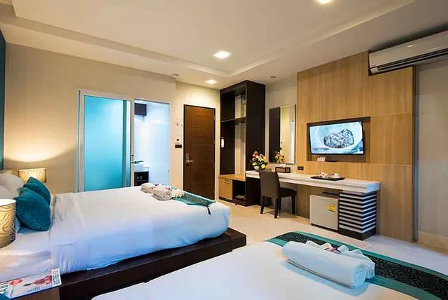 Deluxe, Triple, 1 King and 1 Single Beds, The Nice Hotel 2/3