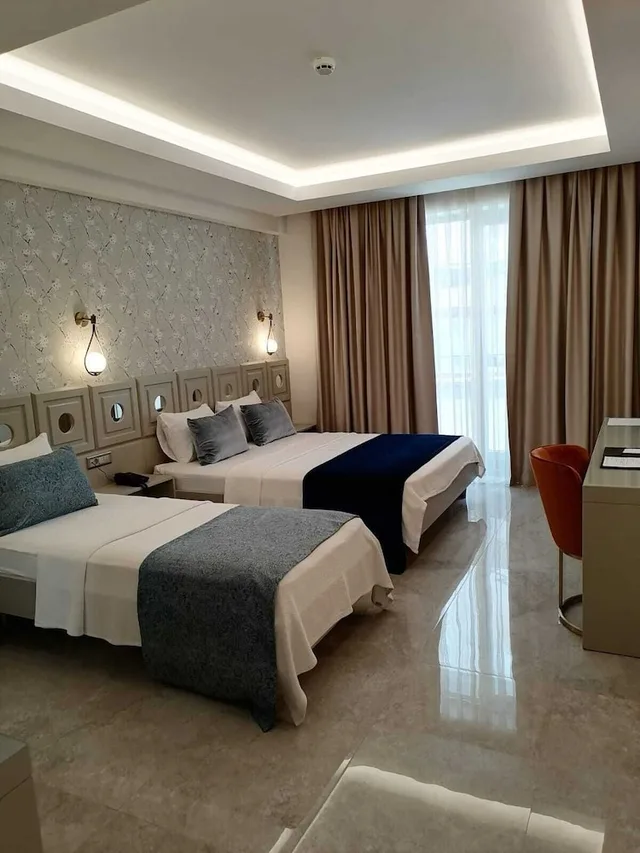 غرفة ديلوكس ثلاثية بسرير كوين وسرير فردي، Muhtar Hotel 1/6