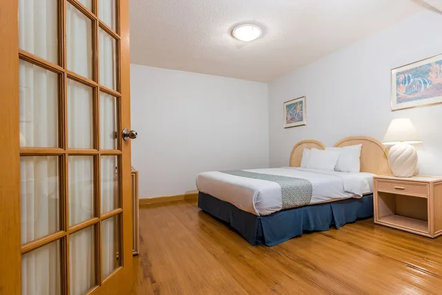 2 Bedrooms, Deluxe, Suite, King and Queen Bed, Partial Ocean View, Kitchen, Alupang Beach Tower 1/4
