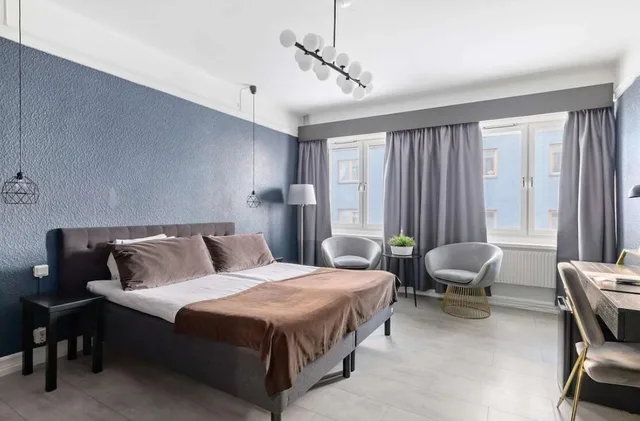 غرفة رباعية بسرير كينج وسرير بطابقين، Centric Hotel 1/9