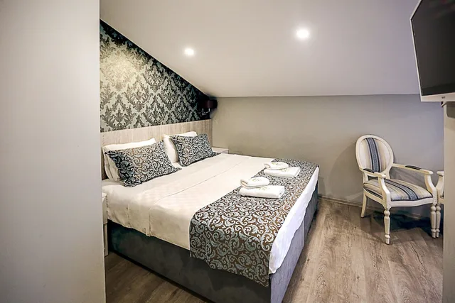 غرفة قياسية بسرير مزدوج أو سريرين منفصلين، Doa Suite Hotel 1/3