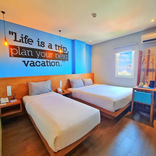 غرفة عائلية بسرير كوين وسرير فردي، Radja Art And Boutique Hotel Semarang 3/4