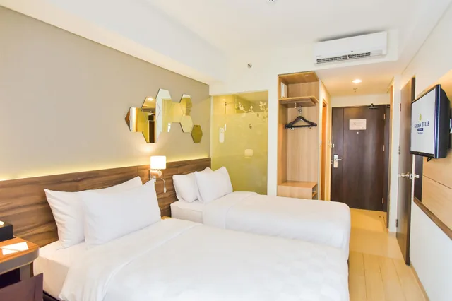 غرفة سوبيريور بسريرين منفصلين بشرفة، Golden Tulip Essential 1/2