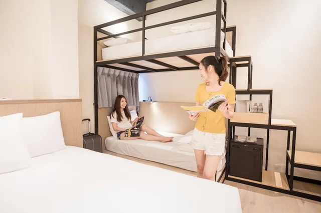 غرفة أساسية رباعية بسرير مزدوج وسرير بطابقين، Traveller-Inn Tiehua Light Spot Hotel 2/2