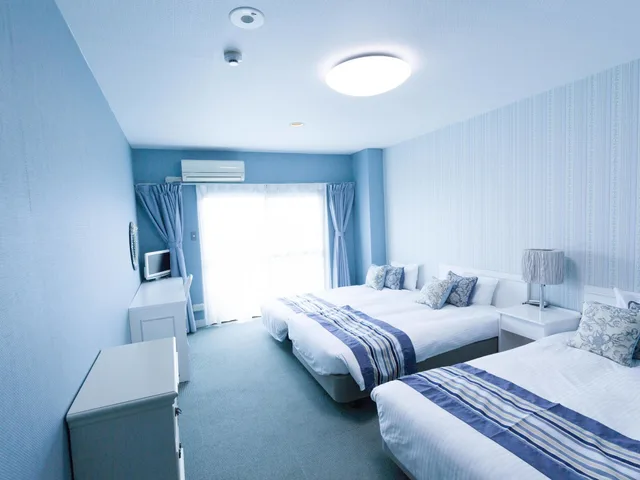 غرفة عائلية بسريرين منفصلين مع أريكة، Hotel Caretta Amami 2/3