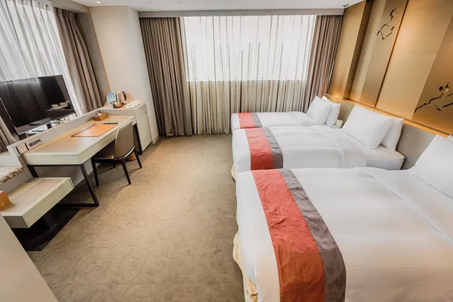 غرفة ديلوكس بثلاثة أسرّة مع سرير إضافي، Green World Hotel Grand Nanjing 1/7
