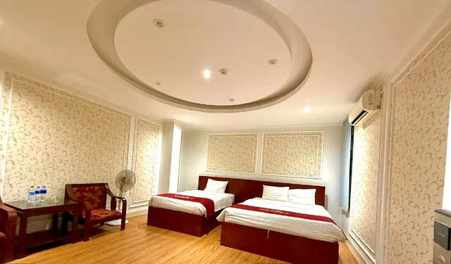 غرفة ديلوكس ثلاثية بسرير مزدوج وسرير فردي، New Amely Hotel & Resident 1/1