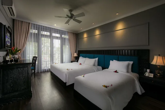 غرفة ديلوكس ثلاثية بسرير كينج وسرير فردي بإطلالة على المدينة، Golden Holiday Hoi An Hotel 6/10