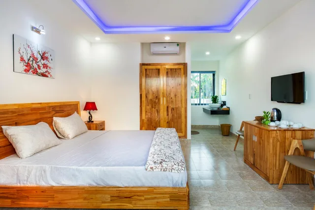 غرفة ديلوكس بسرير كوين بشرفة، Tran Family Villas Boutique Hotel 2/7