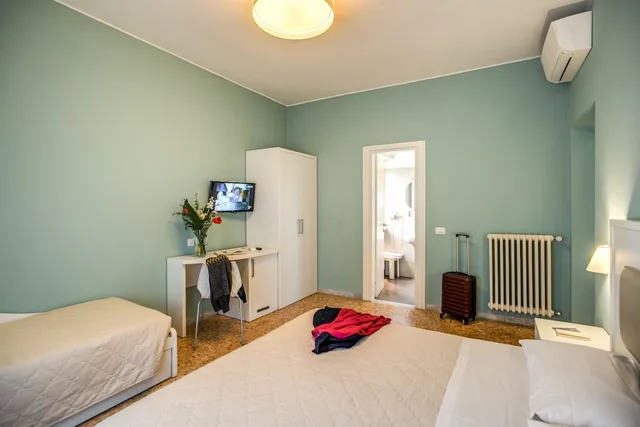 غرفة ديلوكس ثلاثية بسرير مزدوج وسرير فردي، Casa Ravasco 3/5