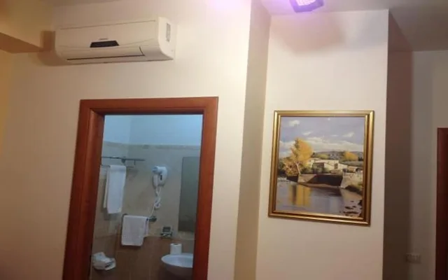غرفة كلاسيكية ثلاثية بسرير مزدوج وسرير فردي، Rome City Inn 2/3