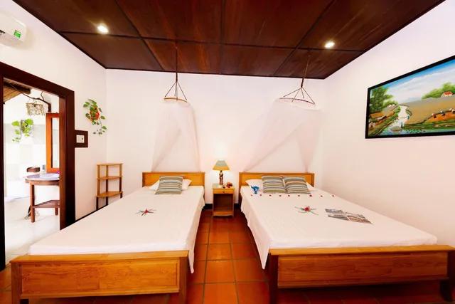 بنغل ثلاثي بسرير مزدوج وسرير فردي بإطلالة على الحديقة، Bao Quynh Bungalow 3/5