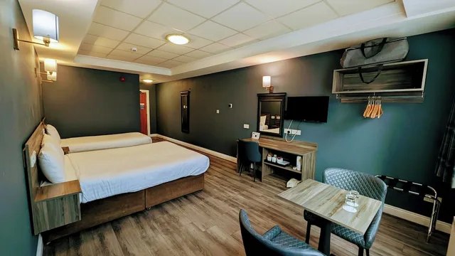 غرفة بسريرين منفصلين وسرير كينج وسرير فردي، Inn On The Coast 9/10