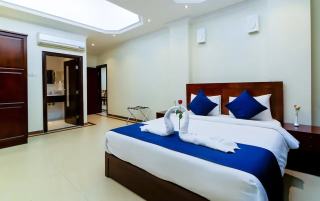 Family Suite, 2 Queen and Twin Beds, Tanzanite Executive Suites 1/7