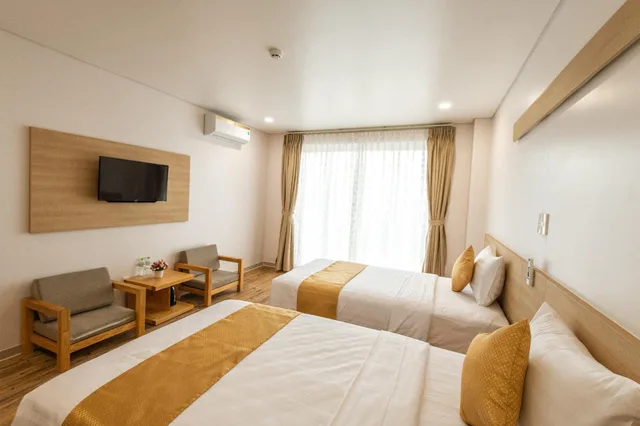 غرفة بريميوم ديلوكس بسرير كوين وسرير فردي بشرفة، Summer Dream Hotel Phu Quoc 1/1