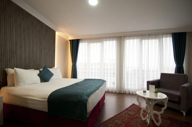 غرفة ديلوكس بسرير كوين وسرير فردي، Nar Sultan Hotel 3/10