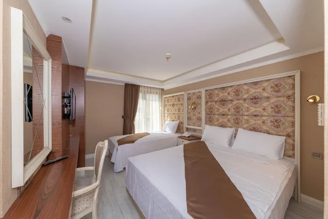 غرفة عائلية ثلاثية بسرير كينج وسرير فردي بإطلالة على المدينة، Sultan City Hotel 6/10