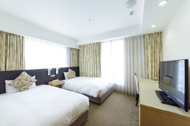 غرفة قياسية بسريرين منفصلين للمدخنين، Nishitetsu Resort Inn Naha 4/10