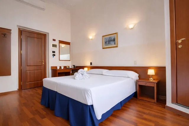 غرفة رباعية بسرير مزدوج وسريرين منفصلين، Palazzo Vecchio Hotel 1/10