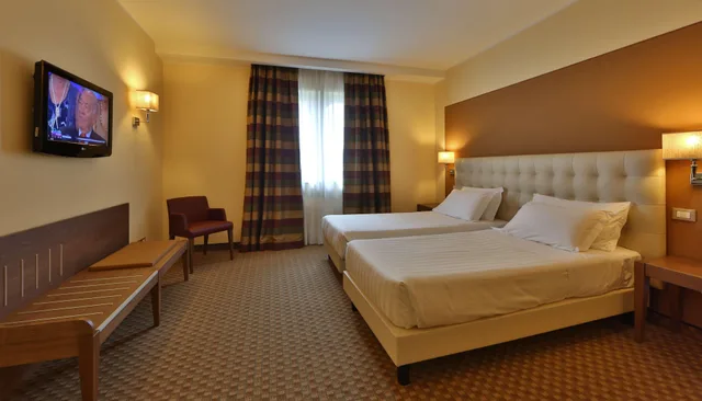 غرفة بسريرين منفصلين، Best Western Grand Htl Guinigi 1/5