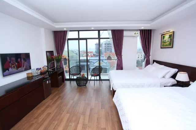 غرفة ديلوكس رباعية بسريرين كينج، Camellia Hotel 1/3