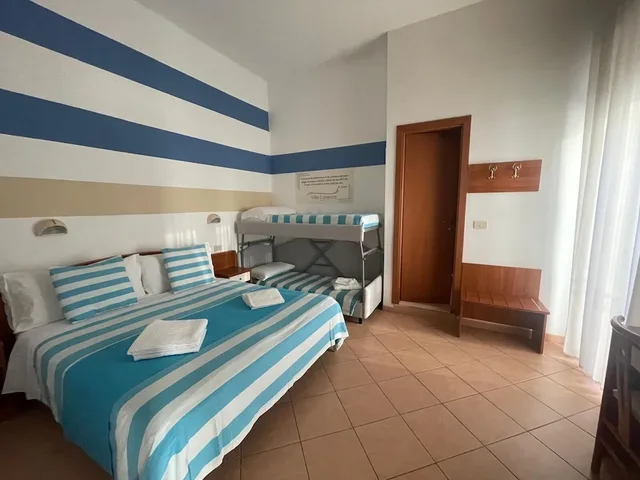 غرفة رباعية بسرير كوين وسرير بطابقين، Hotel Villa Caterina 1/10