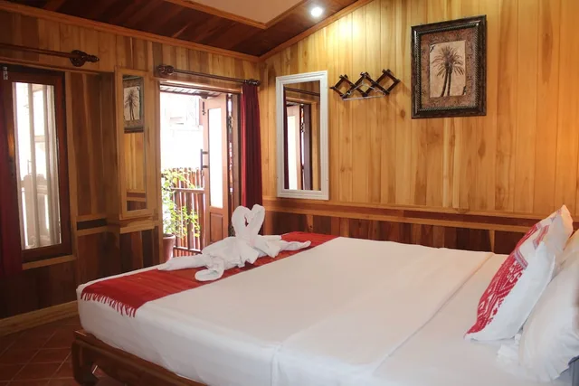 غرفة ديلوكس بسرير كينج بشرفة، Apple Guesthouse 1/6