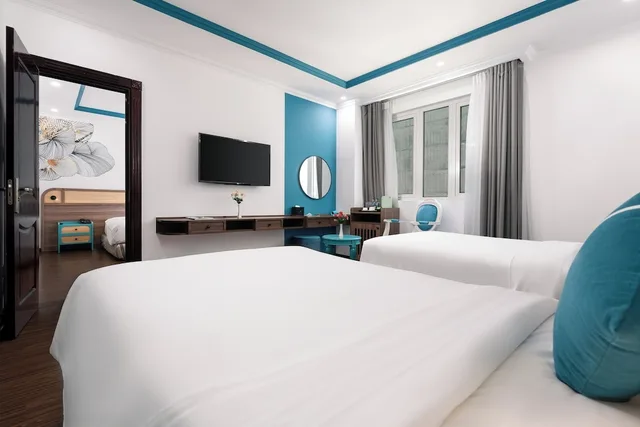 غرفة متصلة عائلية بأربعة أسرّة بإطلالة جزئية على البحر، PARACEL DANANG HOTEL 2/7