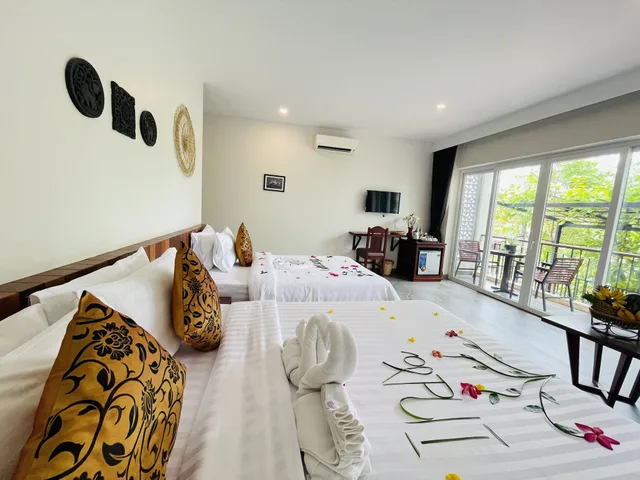 غرفة ديلوكس عائلية بسرير كوين بشرفة، Indra Angkor Residence 5/10